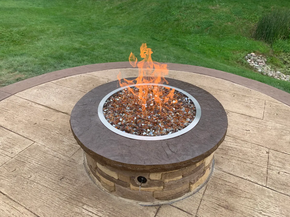 Stamped concrete patio with fire pit in Gary, Indiana Stamped concrete patio with fire pit in Gary, Indiana